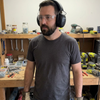 Lifestyle: workshop user wearing CE certified Bluetooth 5.0 ear defenders, safety glasses and gloves