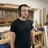 Lifestyle: workshop user wearing NRR22 electronic Bluetooth ear defender muffs