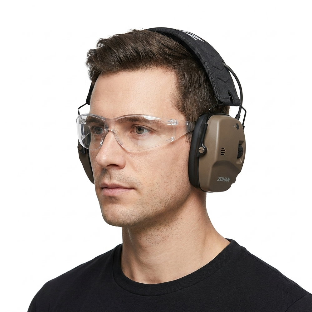Model in PPE goggles wearing NRR22 electronic Bluetooth ear defender muffs on a white background