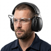 Model in PPE goggles wearing rechargeable Bluetooth ear defender muffs on a white background